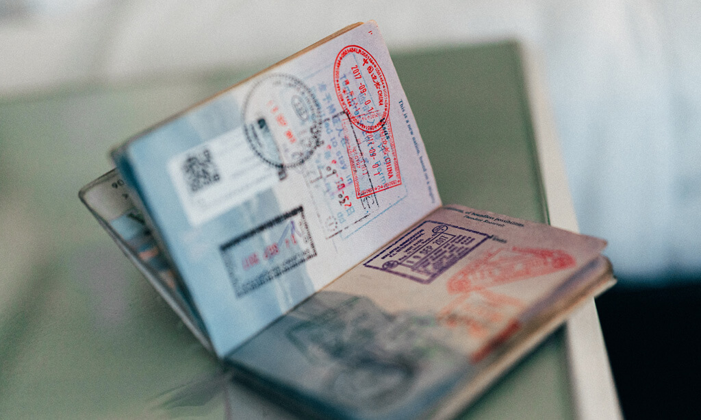 Passport with lots of stamps in it