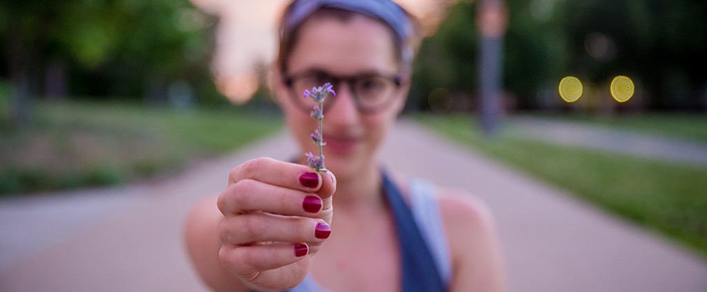 Girl holding flower - giving enough for God
