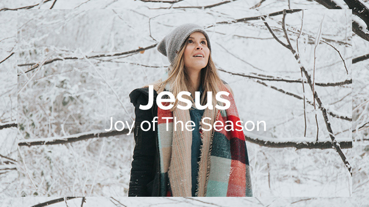 Woman looking around in the snowy woods with the text overlay of Jesus Joy of the Season, a bible reading plan