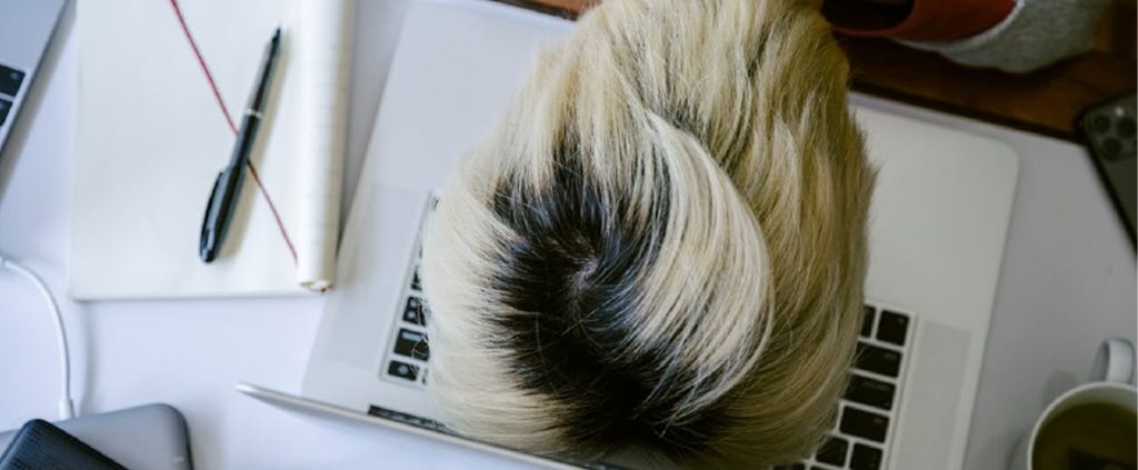Exhausted asian girl with head on the keyboard