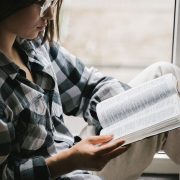 Image of a lady reading the Bible